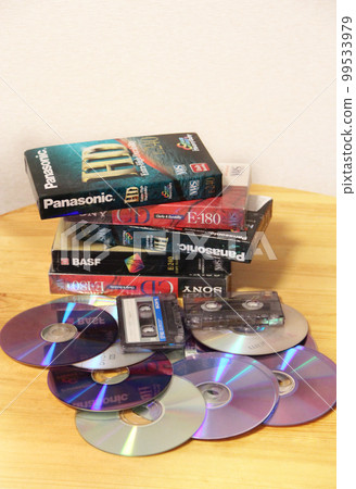 CDs, cassettes, microphone, karaoke, music center. Attributes of the 1990s 99533979
