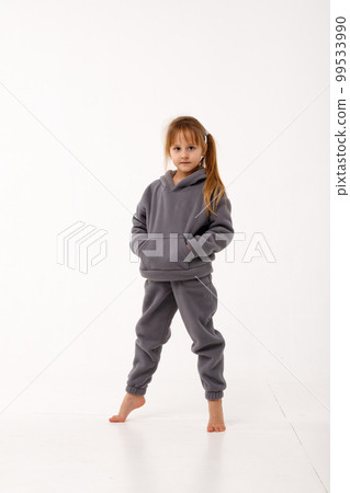 Little girl in thermal clothes, on a white background. 99533990