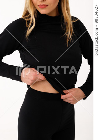 Sporty blonde girl in thermal clothing for women Sporty blonde girl in thermal clothing for women 99534027