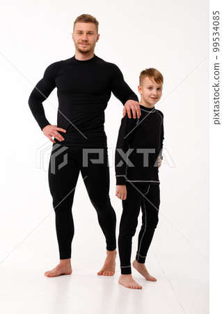Father and son in thermal underwear on a white background Father and son in thermal underwear on a white background 99534085