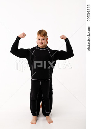 Father and son in thermal underwear on a white background Father and son in thermal underwear on a white background 99534263