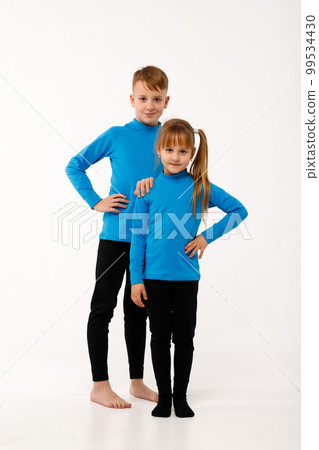 A little girl and her older brother in thermal clothes. 99534430
