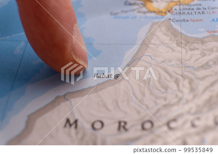 Finger pointing to Rabat, Morocco on colorful map with selective focus, shallow depth of field, background blur. High quality photo Finger pointing to Rabat, Morocco on colorful map with selective focus, shallow depth of field, background blur. High quality photo 99535849
