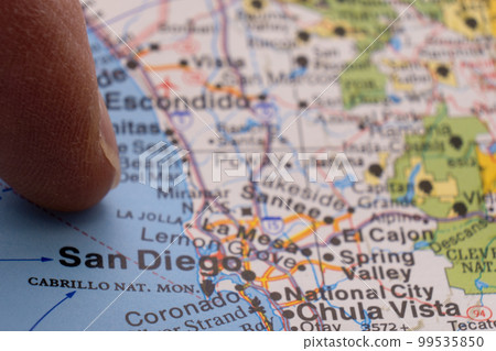 Finger pointing to San Diego, California on colorful map with selective focus, shallow depth of field, background blur. High quality photo Finger pointing to San Diego, California on colorful map with selective focus, shallow depth of field, background blur. High quality photo 99535850