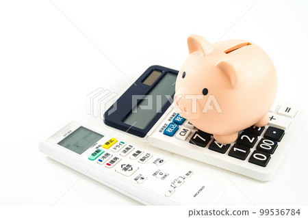 Electricity saving image Air conditioner remote control, calculator and piggy bank 99536784