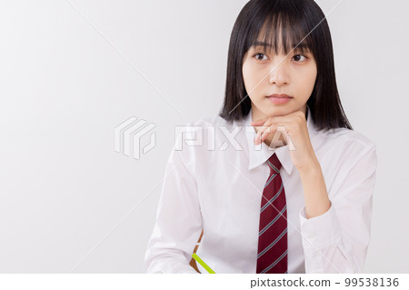 High school girl listening seriously to class High school girl listening seriously to class 99538136