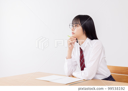 High school girl listening seriously to class 99538192