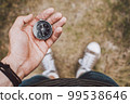 Traveler holding compass in hand 99538646