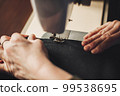 Woman working with sewing machine 99538695