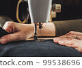 Woman working with sewing machine 99538696