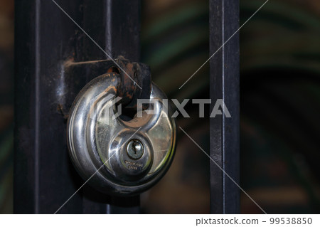 Access Gate Secured With Round Stainless Steel Lock Access Gate Secured With Round Stainless Steel Lock 99538850