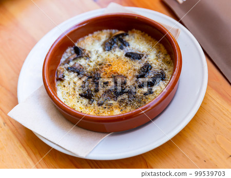 Provolone cheese baked with mushrooms seasoned with Italian herbs 99539703