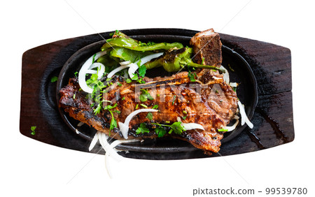 Delicious veal entrecote with potatoes and vegetables Delicious veal entrecote with potatoes and vegetables 99539780