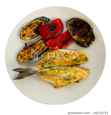 Baked vegetables and bream fillet on plate, dorada a la plancha, traditional spanish dish Baked vegetables and bream fillet on plate, dorada a la plancha, traditional spanish dish 99539781