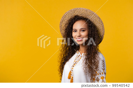 Beautiful woman in ethnic ukrainian costume on yellow. Ukraine, style, folk. Beautiful woman in ethnic ukrainian costume on yellow. Ukraine, style, folk. 99540542