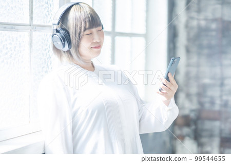 Body positive woman enjoying music subscription Body positive woman enjoying music subscription 99544655