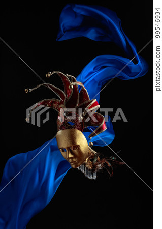 Old carnival masks with flutters blue cloth. Old carnival masks with flutters blue cloth. 99546934