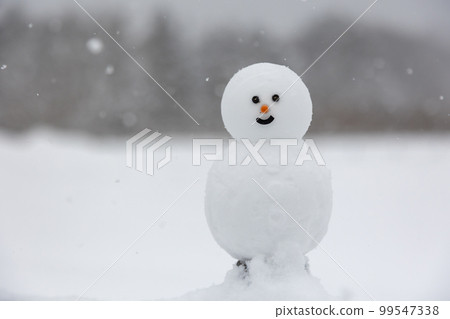 A snowy plateau, a simple snowman A snowy plateau, a simple snowman 99547338