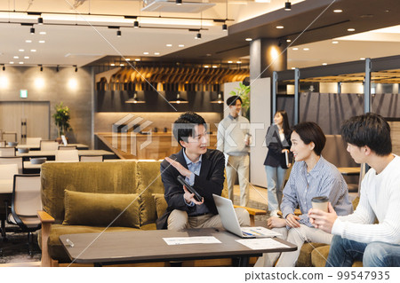 Businessman working in designer's office Businessman working in designer's office 99547935