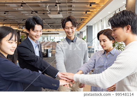 A circle of people working in a fashionable designer's office A circle of people working in a fashionable designer's office 99548114