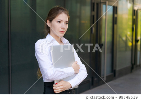 Portrait confident successful young woman, formally dressed, business woman Portrait confident successful young woman, formally dressed, business woman 99548519