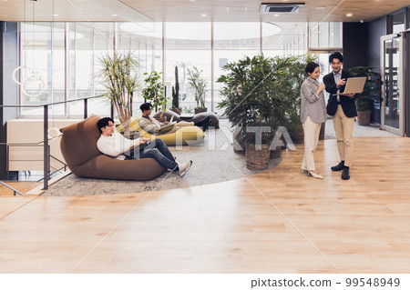 Men and women working in a designer's office, bead cushions, table cushions Men and women working in a designer's office, bead cushions, table cushions 99548949