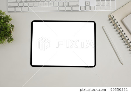 Modern workspace top view with keyboard, book, decor plant, stylus pen and digital tablet 99550331