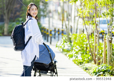 Young woman traveling in a stroller Young woman traveling in a stroller 99551948