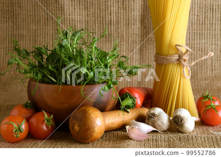 Still life cooking ingredients Italian food fabric background indoors Still life cooking ingredients Italian food fabric background indoors 99552786