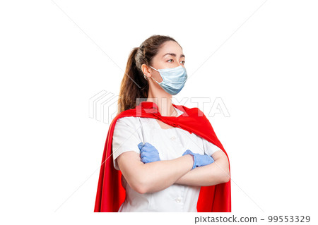 A doctor wearing in a medical face mask, gloves and a superhero Cape, ready to work. Isolated on white background. The concept of the Power of a super hero for medicine A doctor wearing in a medical face mask, gloves and a superhero Cape, ready to work. Isolated on white background. The concept of the Power of a super hero for medicine 99553329