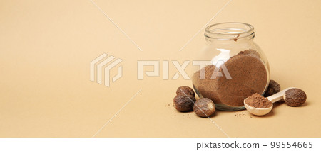 Concept of spices and condiments, nutmegs, space for text Concept of spices and condiments, nutmegs, space for text 99554665