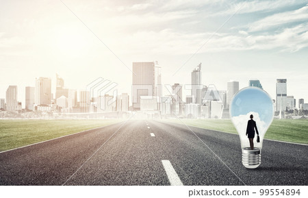 Businesswoman inside light bulb 99554894
