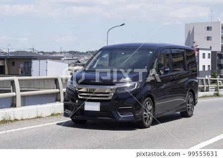 One box car minivan road driving One box car minivan road driving 99555631