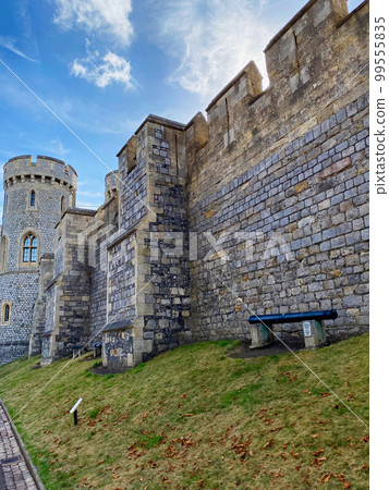 Castle walls in the fairy tale grounds of Windsor Castle, the official residence of the British monarch on the outskirts of London Castle walls in the fairy tale grounds of Windsor Castle, the official residence of the British monarch on the outskirts of London 99555835