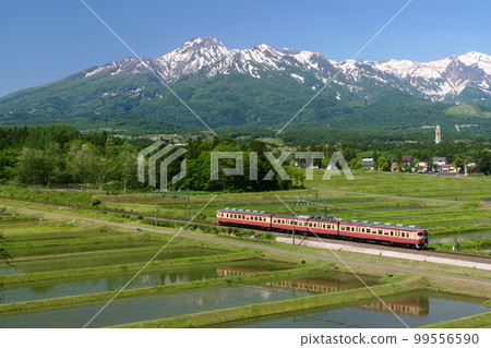 Mt. Myoko with remaining snow and Series 413 on the Myoko Haneuma Line 99556590