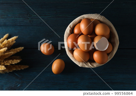 Concept of fresh and natural farm product - eggs, top view Concept of fresh and natural farm product - eggs, top view 99556864