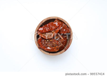 Concept of tasty food - sun-dried tomato, isolated on white background Concept of tasty food - sun-dried tomato, isolated on white background 99557414