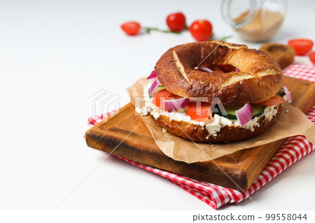 Concept of delicious food - tasty bagel sandwich, space for text 99558044