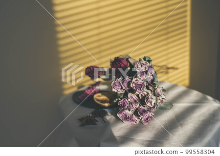 Yellow background and dried flowers and interior accessories 99558304