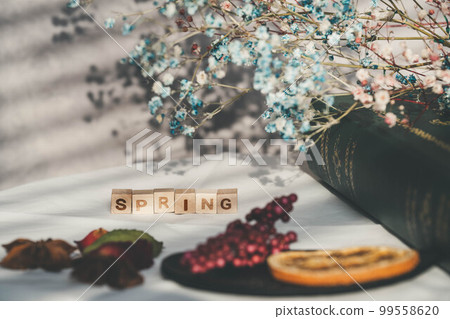 Blind shadows, coffee cups and dried flowers Blind shadows, coffee cups and dried flowers 99558620