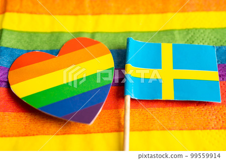 Sweden flag on rainbow background flag symbol of LGBT gay pride month  social movement rainbow flag is a symbol of lesbian, gay, bisexual, transgender, human rights, tolerance and peace. Sweden flag on rainbow background flag symbol of LGBT gay pride month  social movement rainbow flag is a symbol of lesbian, gay, bisexual, transgender, human rights, tolerance and peace. 99559914