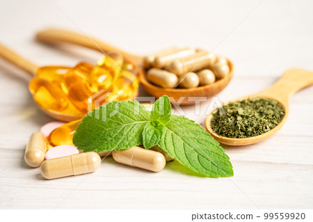 Alternative medicine herbal organic capsule with vitamin E omega 3 fish oil, mineral, drug with herbs leaf natural supplements for healthy good life. 99559920