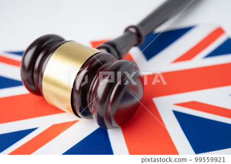Gavel for judge lawyer on United Kingdom flag, finance concept. Gavel for judge lawyer on United Kingdom flag, finance concept. 99559921