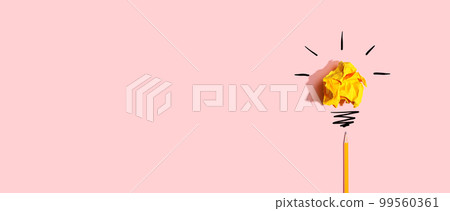 Brainstorming concept with a crumpled paper light bulb and a pencil Brainstorming concept with a crumpled paper light bulb and a pencil 99560361