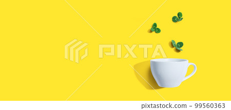 Shamrock leaves with coffee cup Shamrock leaves with coffee cup 99560363