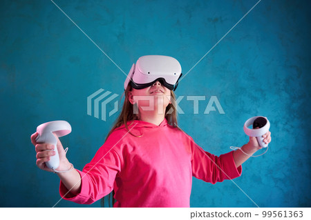 little girl playing with VR glasses little girl playing with VR glasses 99561363