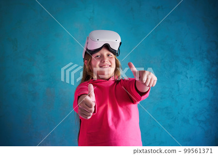 little girl playing with VR glasses little girl playing with VR glasses 99561371