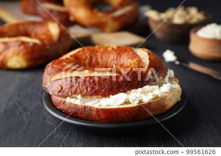 Concept of tasty food - bagel, tasty bakery products Concept of tasty food - bagel, tasty bakery products 99561626