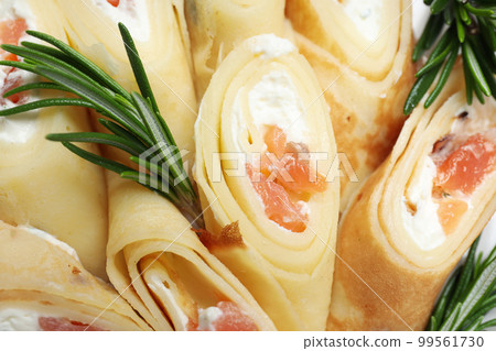 Concept of tasty food, thin pancakes with filling Concept of tasty food, thin pancakes with filling 99561730
