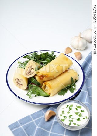Concept of tasty food, thin pancakes with filling, space for text 99561752